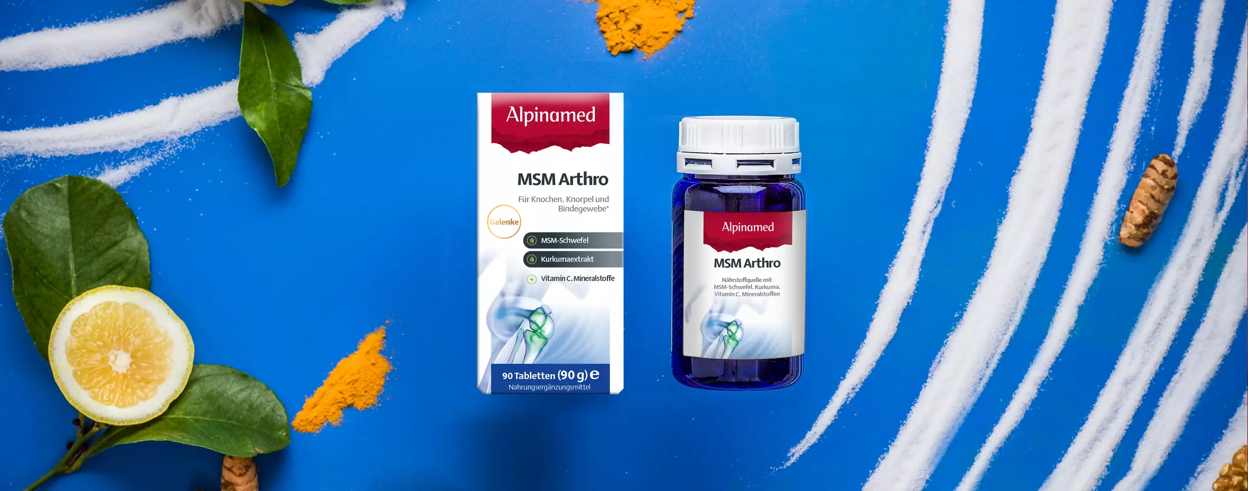 Alpinamed MSM Arthro liegend mit MSM Schwefel Curcuma und Vitamin C Zitrone daneben